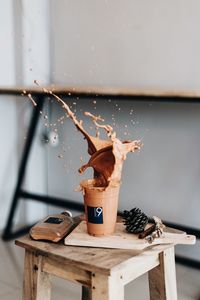 Close-up of coffee splashing on table