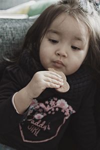 Close-up of cute girl holding ice cream