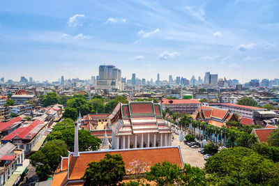 High angle view of buildings in city against sky