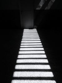 Shadow of sunlight on tiled floor