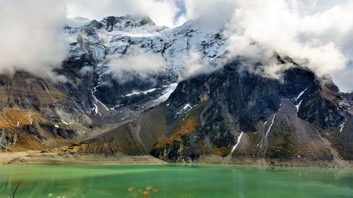 Scenic view of lake against mountain range