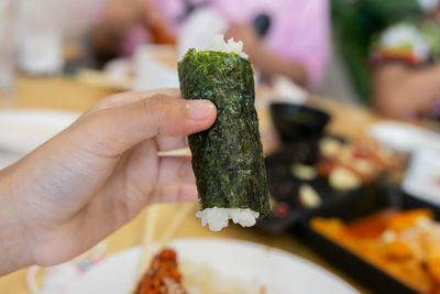 Close-up of hand holding food