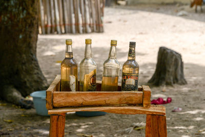 Close-up of wine bottles on table