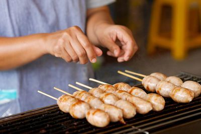 Midsection of man preparing food