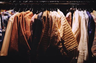 Close-up of clothes hanging on display at store