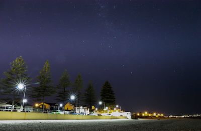 Illuminated building against sky at night
