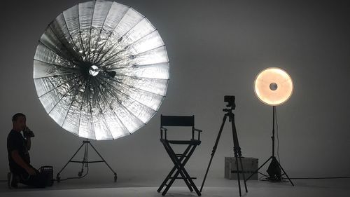 Low angle view of illuminated ferris wheel against sky