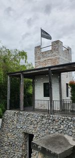 Low angle view of abandoned built structure against sky