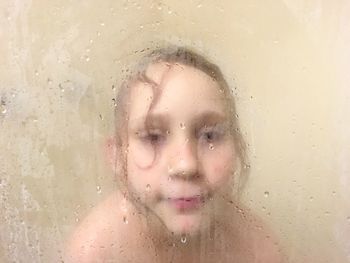 Close-up of girl with reflection in water