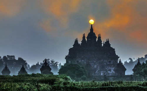 View of temple against building