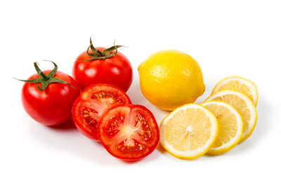 Close-up of fruits against white background