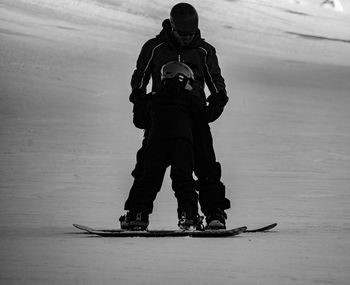 Low angle view of people on snow