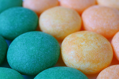 Macro shot of delicious sugar coated round candies, for texture and background with selective focus
