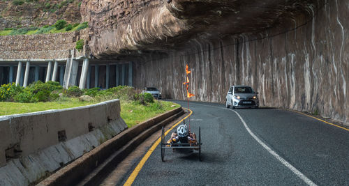 Vehicles on road in tunnel
