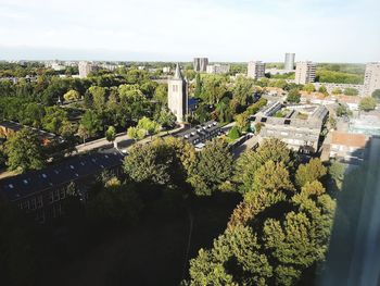 High angle view of trees and buildings against sky