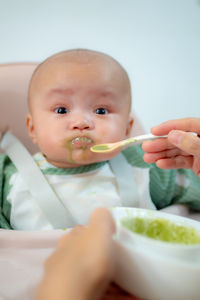 Portrait of cute boy eating food