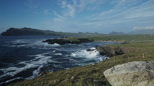 Scenic view of sea by cliffs