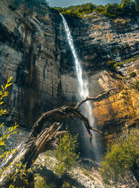 View of waterfall on rocks