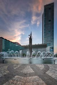 Building against cloudy sky