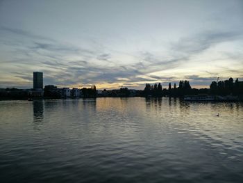 Reflection of clouds in sea at dusk