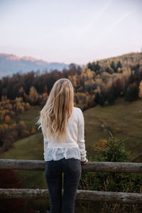 Rear view of woman looking at landscape