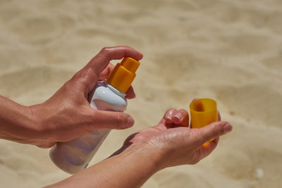 Cropped image of man holding pills