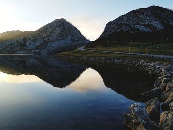 Scenic view of lake and mountains against sky