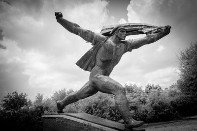 Low angle view of statue against sky