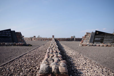 Railroad track amidst buildings against sky