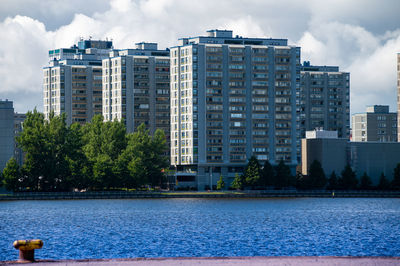Urban metropolitan borough with tall concrete residential buildings on a sunny summer day.