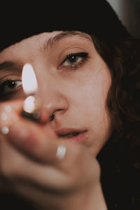 Close-up portrait of young woman looking away