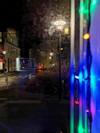 Illuminated street and buildings at night