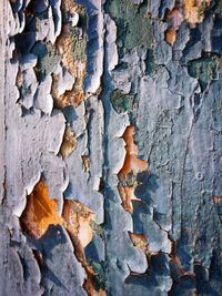 Full frame shot of peeled wall on sunny day