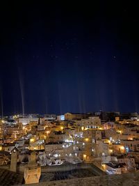 High angle view of illuminated buildings in city at night