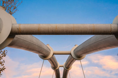 Low angle view of pipe against sky