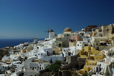 View of town against blue sky