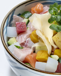 High angle view of chopped fruits in bowl on table