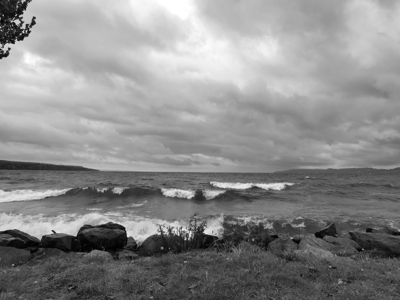 water, sky, sea, cloud - sky, beach, tranquil scene, tranquility, shore, horizon over water, scenics, cloudy, beauty in nature, nature, cloud, overcast, rock - object, idyllic, coastline, sand, day