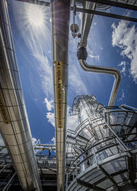 Low angle view of metallic structure against sky