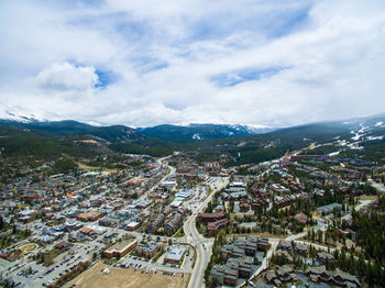 High angle view of cityscape against cloudy sky