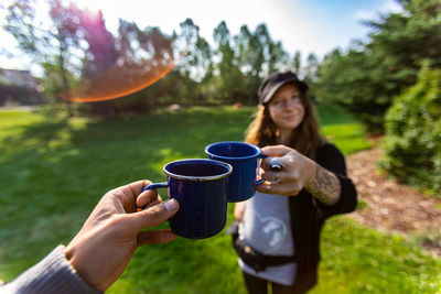 Young woman holding coffee cup