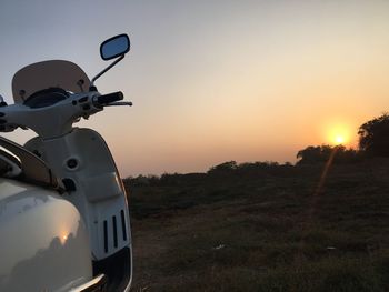 Man on road against sky during sunset