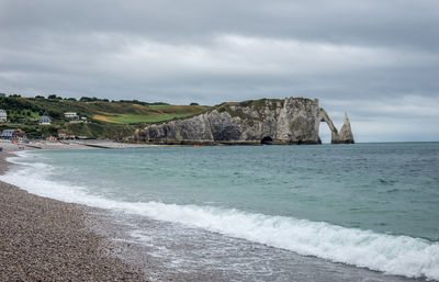 Scenic view of cliffs of Étretat against sky