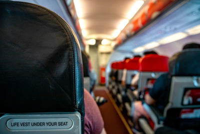 Rear view of man traveling in bus