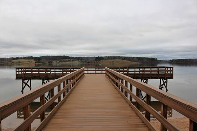 Pier over sea against sky