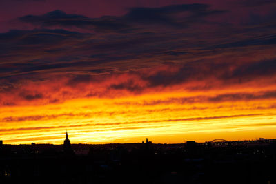 Silhouette of building at sunset