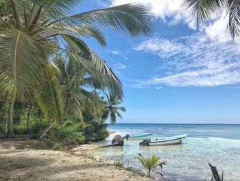 Scenic view of sea against blue sky