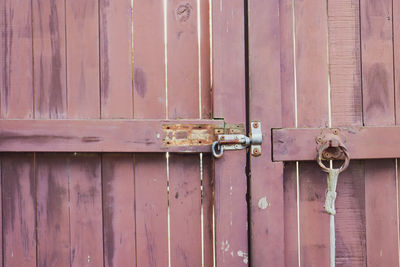 Close-up of closed timber gate