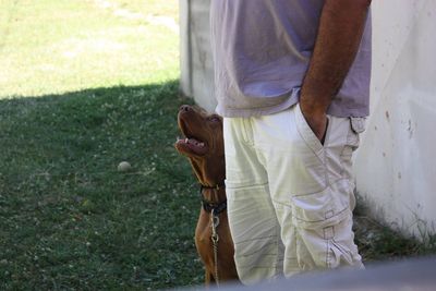 Low section of man standing on ground