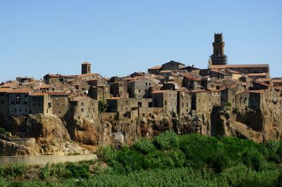 Old house at pitigliano against sky